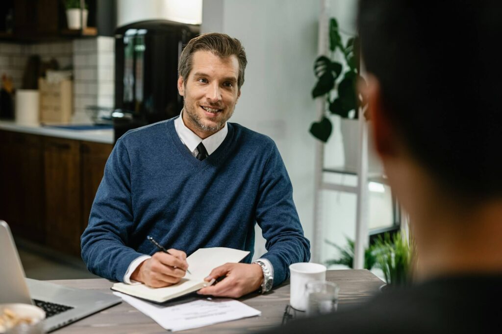 financial consultant planning home finances with his client